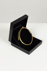 TWISTED NAIL BANGLE 18KT GOLD