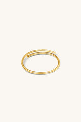 TWISTED NAIL BANGLE 18KT GOLD