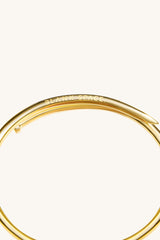 TWISTED NAIL BANGLE 18KT GOLD